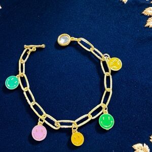 Hand Crafted gold link bracelet with green, yellow, pink & teal smile charms
